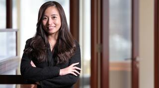 woman standing with arms crossed