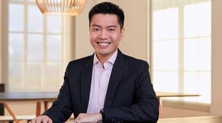 man sitting with cup