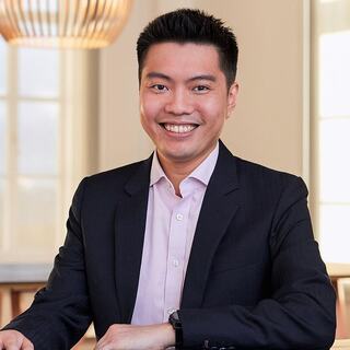 man sitting with cup