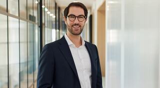 man standing with glasses